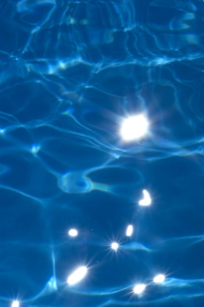 Crystal clear water in a solar-heated swimming pool