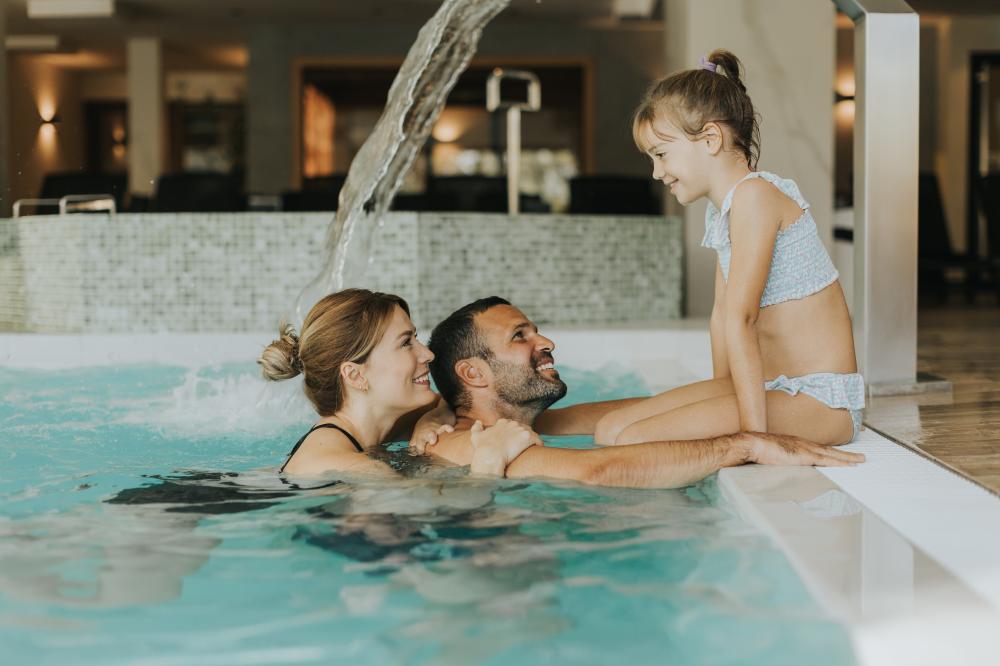 Family enjoying heated indoor swimming pool