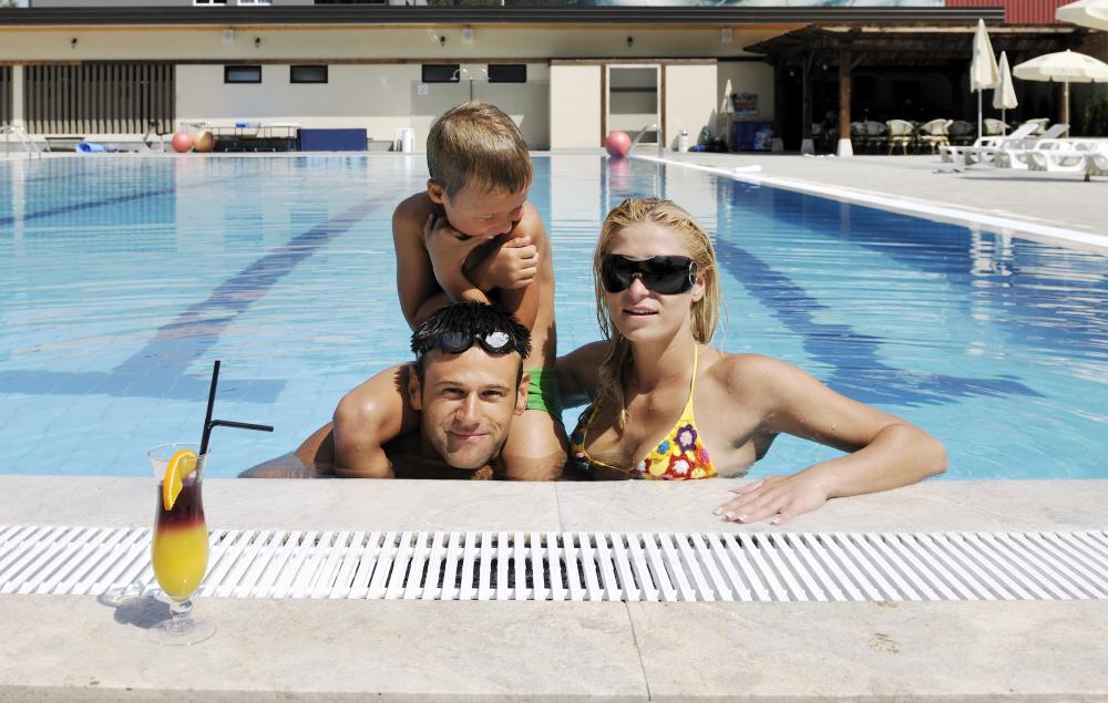 Family enjoying a warm swim in a solar-heated pool