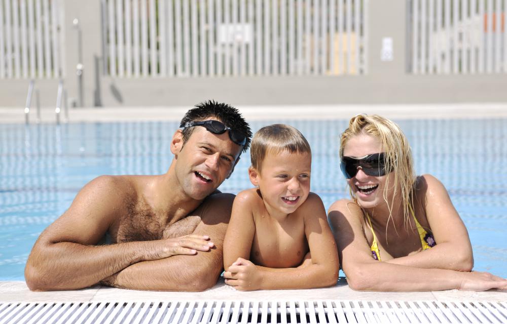 Family enjoying their heated swimming pool in DeBary