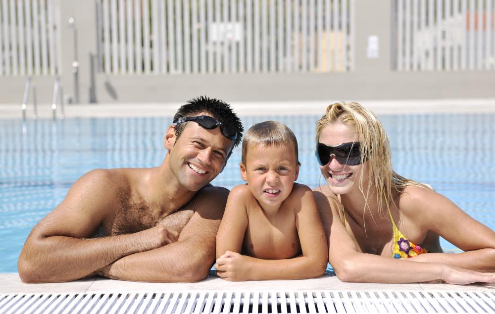 Family enjoying a warm pool in Daytona Beach thanks to a heat pump