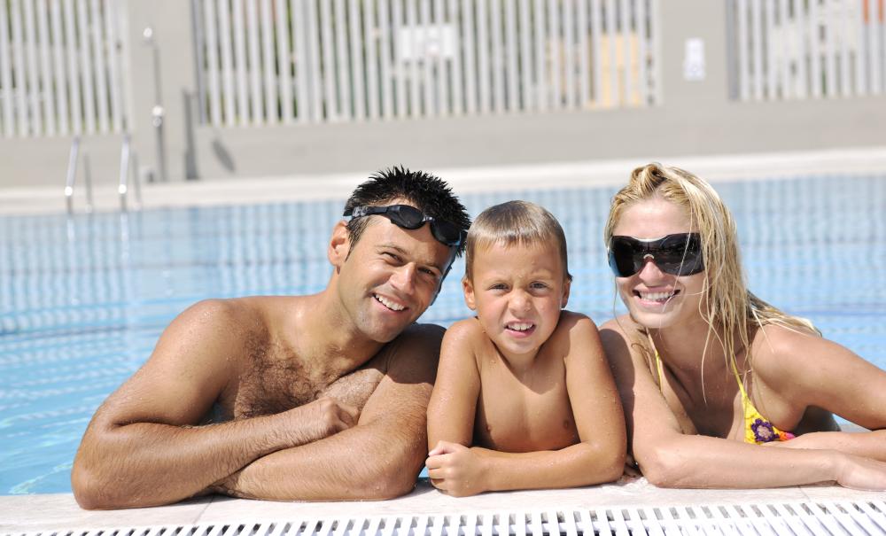 Family enjoying solar-heated swimming pool in Heathrow