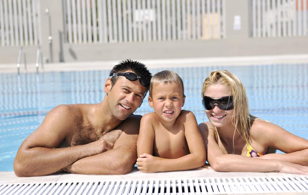 Family enjoying heated pool highlighting Heathrow pool heat pumps benefits