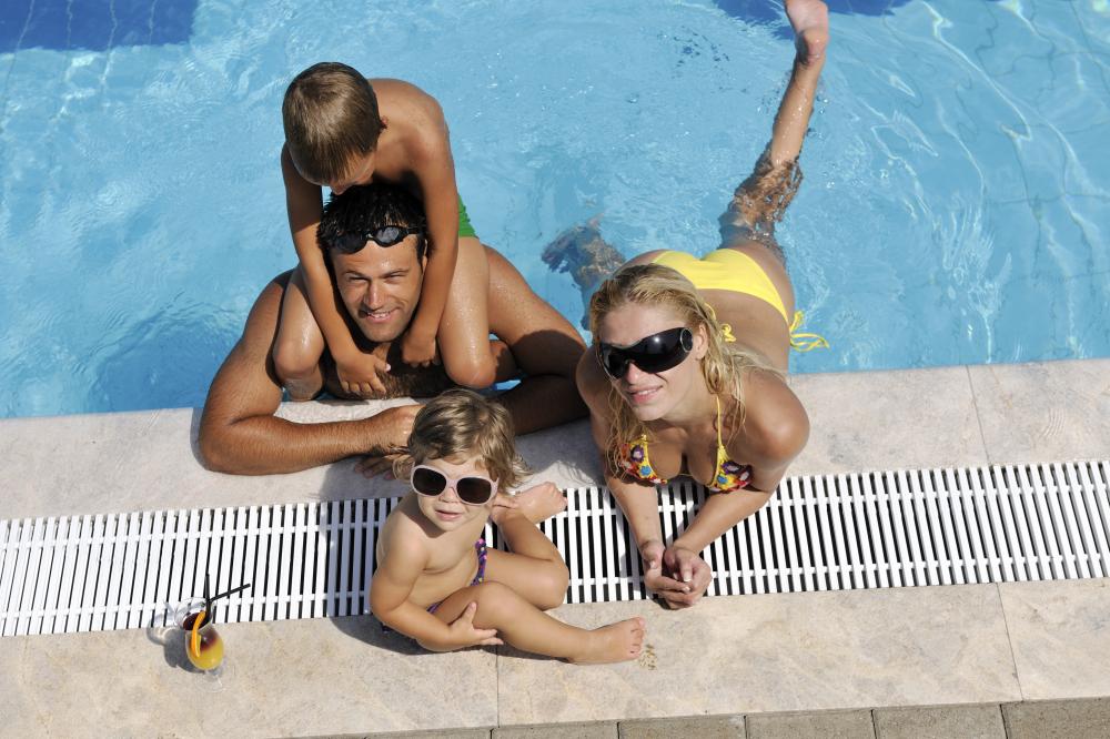 Family enjoying solar-heated pool in Seminole County